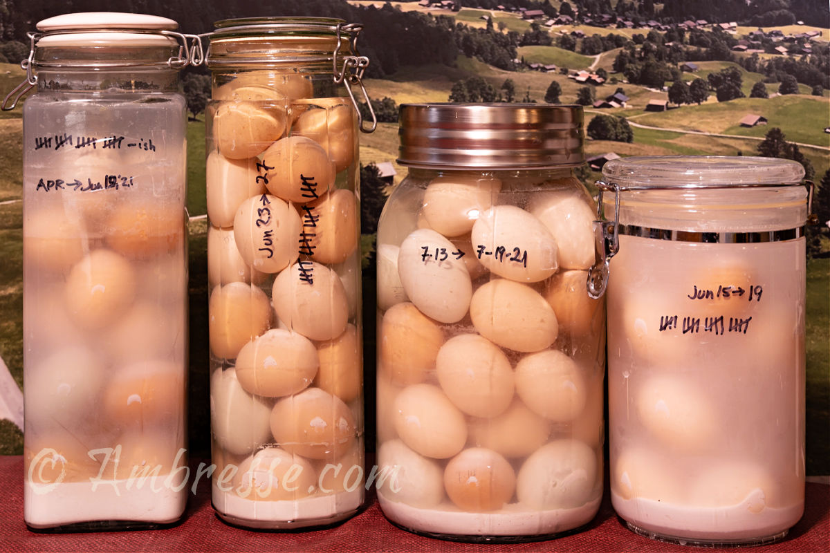 Four large glass jars of water glassed eggs. Most of these are American Bresse eggs. The photo was taken in January, when the eggs were six months old and still very fresh.