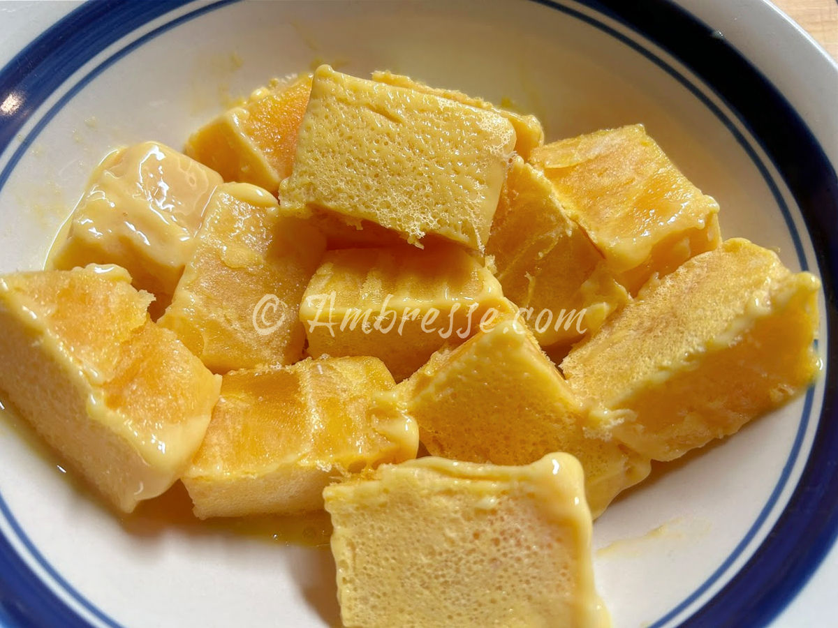 Eggs frozen in an ice cube tray and placed in a bowl.