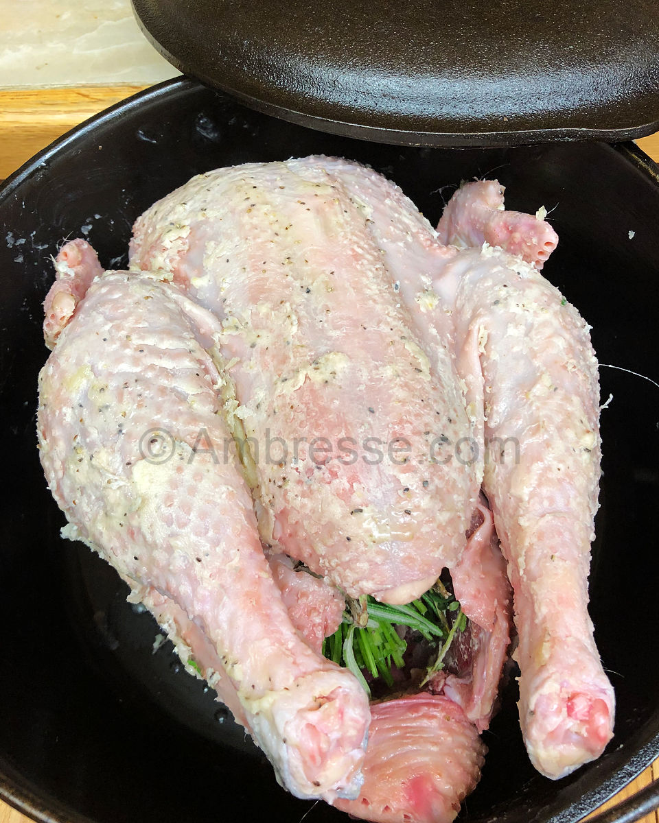 American Bresse poultry is prepped and ready for roasting in a cast iron dutch oven.