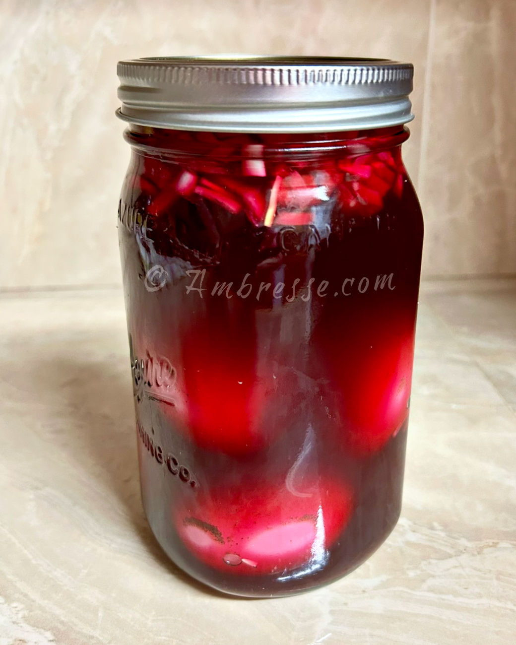 Pickled eggs in apple cider vinegar and beet juice.