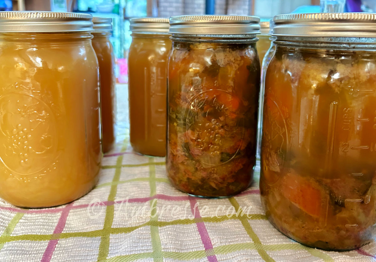 Several quart jars of Bresse broth and chicken soup (8478).