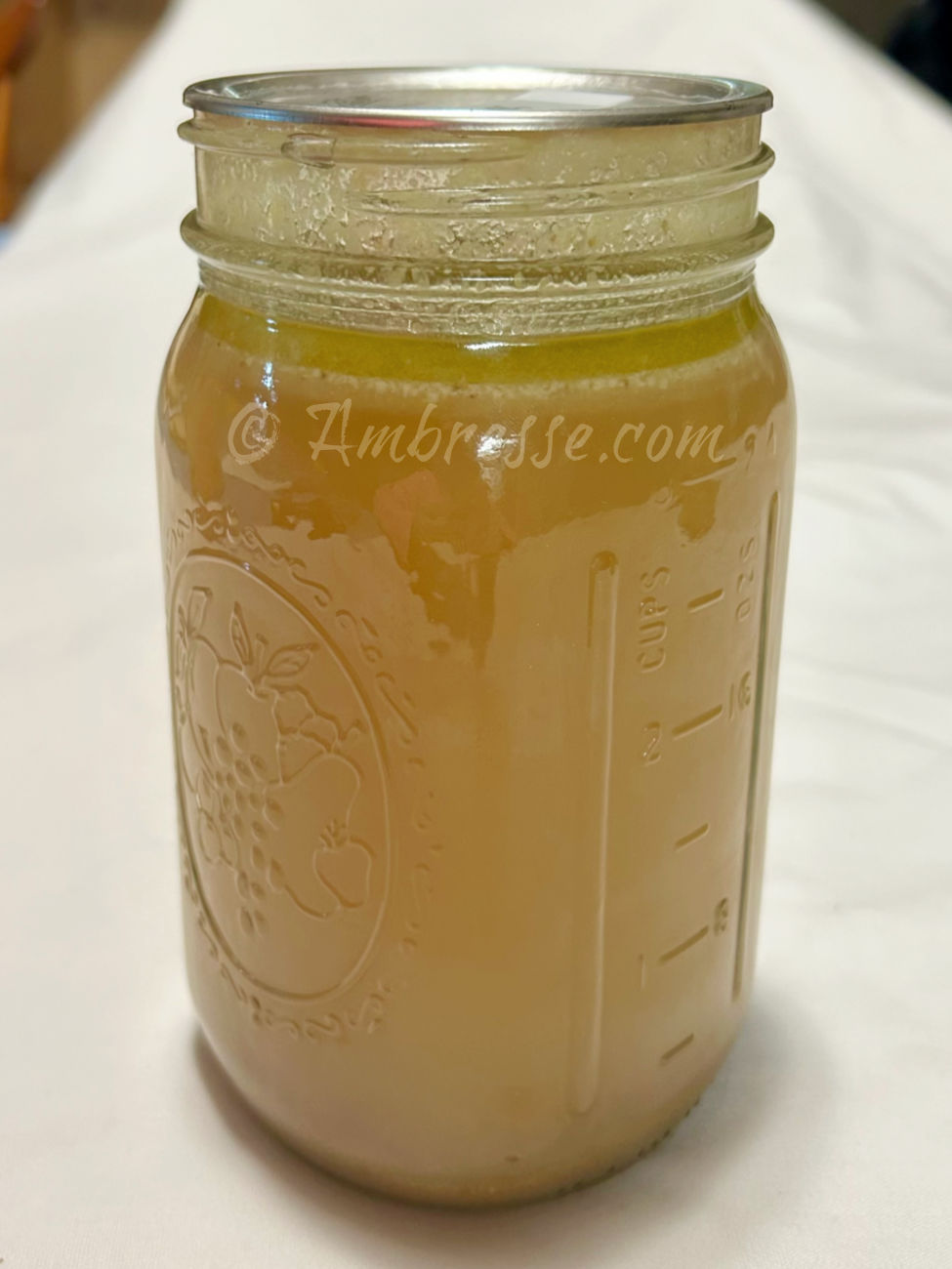 One quart home-canned chicken bone broth (9316).