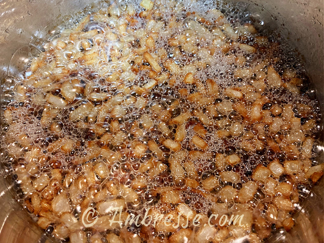 Gribenes simmering in schmaltz and nearly browned.